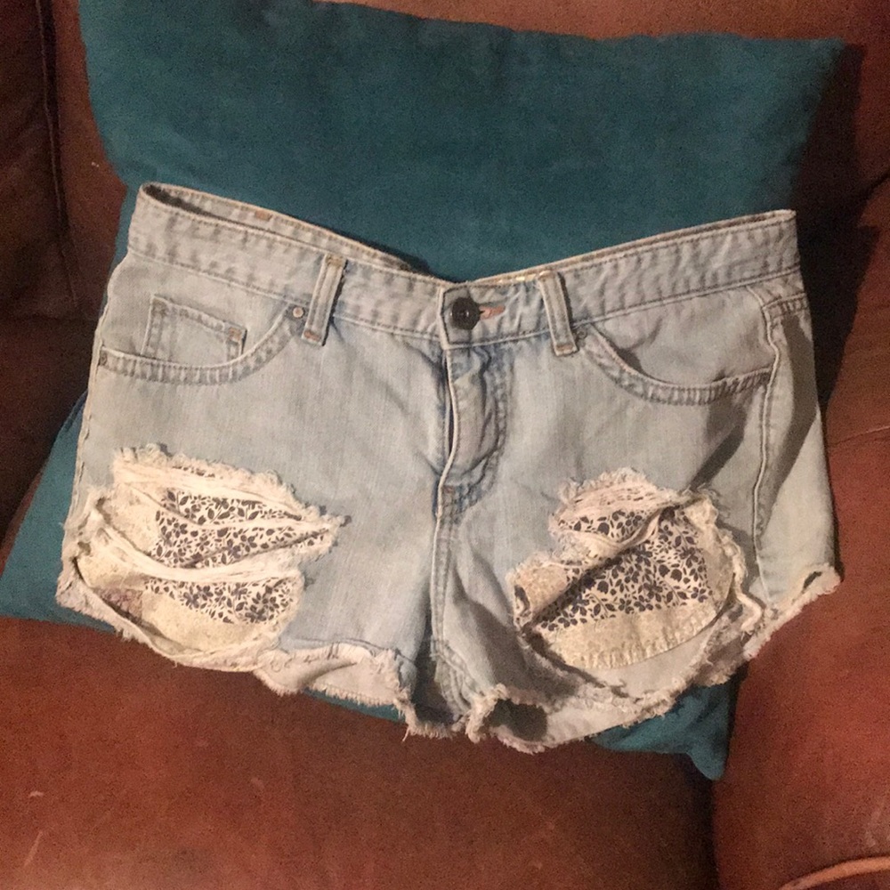 Denim  shorts with torn front sides